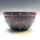 A 19th century beech dairy bowl, with brass studs applied to the body, height 13cm, diameter 25cm.
