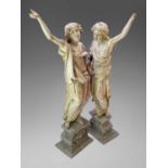 A pair of 17th century carved figures representing the seasons, possibly limewood, each in draped