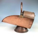 A Georgian copper coal scuttle, height 30.5cm, length 49cm, width 28cm.