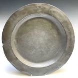 An 18th century pewter charger, London touch marks, diameter 41.5cm.
