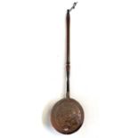 An 18th century copper warming pan, with turned wood handle, length 105cm, diameter 26cm.Provenance:
