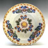 A Delft polychrome dish, 18th century, with floral decoration, diameter 23cm.Provenance: Michael