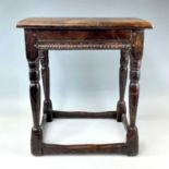 A 17th century style oak joint stool, height 48cm, width 44.5cm, depth 29.5cm.Provenance: From the