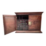 A Portuguese rosewood and walnut cabinet, 17th/18th century, the pair of doors opening to reveal a