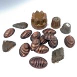 A Victorian copper jelly mould, height 7.5cm, diameter 10cm and 17 other mainly copper moulds. (18)
