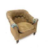 A Victorian upholstered button back tub chair on turned legs and castor wheels, height 73cm width