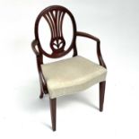 A19th century mahogany elbow chair, the oval back with pierced splat and foliage and serpentine
