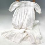 A 19th century cotton child's nightgown together with seven other christening gowns and