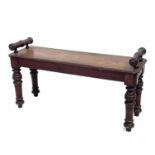 A Victorian mahogany window seat, with turned ends and raised on turned legs, height 48cm, width