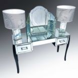 A Laura Ashley mirroroed glass dressing table, fitted two drawers on ebonised legs, height 75.5cm,