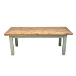 A Large pine topped kitchen or dining table, 20th century, raised on a painted underframe with