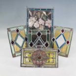 A Victorian stained glass panel, with painted floral design, 43 X 27.5cm, together with four similar