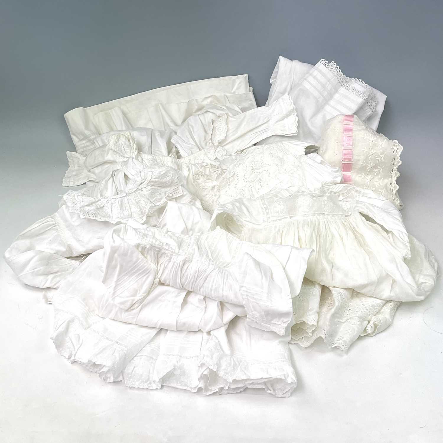 An early 20th century child's nightgown together with four other christening robes and nightgown and