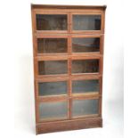 An oak sectional bookcase, mid 20th century, fitted with five pairs of glazed doors, height 159cm,
