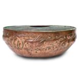 A Newlyn copper rose bowl, the planished ground repousse decorated with a band of fish, diameter