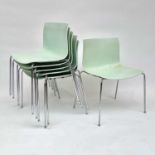 A set of six Italian contemporary Arper Catifa stacking dining chairs, with green moulded seats