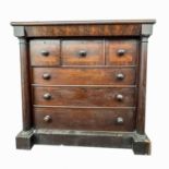 A Victorian mahogany and crossbanded chest of three short and three long drawers, with a concealed