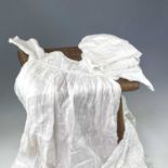 A late 19th century girl's muslin nightgown, together with three other nightgowns and three child
