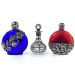 A sterling silver overlay glass scent bottle and stopper, height 9.5cm; together with a pair white