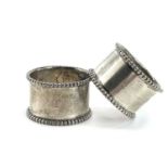 A pair of Victorian heavy silver napkin rings with beaded edges by James Dixon & Sons, Birmingham