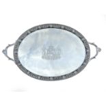 An impressive George III silver Neo-Classical large oval twin handled tea tray, the beaded edge cast