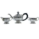 A George VI silver batchelor tea set by W Haywood, Birmingham 1945, height of teapot 13cm, weight