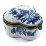 A 19th century blue and white tin glazed lobed hinge lidded box, the white metal rims with scallop
