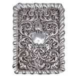 A Victorian silver dressing table tray by John & William Deakin, of rectangular form with