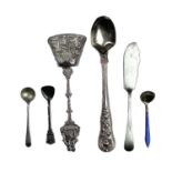 A collection of mixed silver flatwares to include a William IV condiment spoon with rose cast