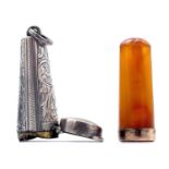 An Edwardian silver foliate engraved fob cheroot holder case, enclosing an amber cheroot holder with