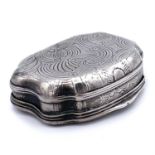 An 18th century German silver snuff box, of cartouche shape, the hinged lid engraved with a