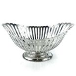 An Edwardian silver boat shaped pedestal cake basket by William Hutton & Sons Ltd, with lobed rim