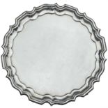 A George V silver salver by Silversmith & Goldsmiths Company, with pie crust rim and raised on