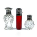 A Victorian silver hinge lidded cranberry glass scent bottle, maker GM, Birmingham 1893, height 7cm;