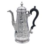 A George II silver baluster coffee pot possibly by Christian Hillan, the body and spout foliate