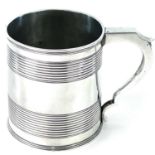 A George III silver cylindrical mug with two reeded bands, indistinct makers mark, London 1810,