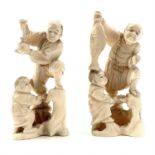 A pair of Japanese Meiji period carved ivory Okimono, both depicting a gentleman with boy, both