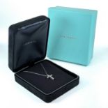 A Tiffany & Co platinum and diamond set cross pendant necklace, the cross with 11 brilliant cut