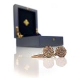 A pair 18ct gold and diamond set earrings designed by Kat Florence, each earring set with central