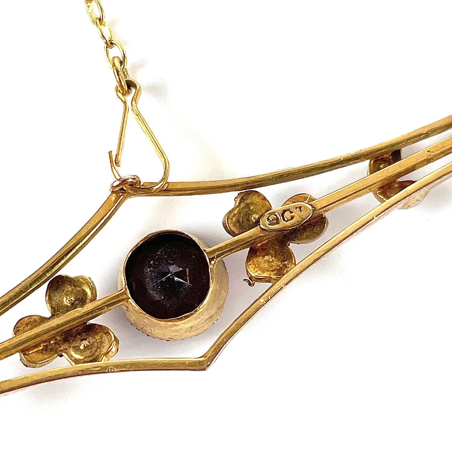A 9ct gold garnet and seed pearl set bar brooch, base metal pin, width 57mm, weight 3.75g. - Image 2 of 7