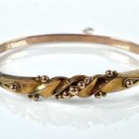 A Victorian 9ct hallmarked gold hinged hollow bangle, weight 5.8g.