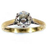 An 18ct gold diamond solitaire ring, the round cut diamond measuring 0.70ct, London 1988, size I/