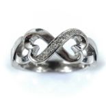 A Tiffany 18ct white gold Paloma Picasso ring set with diamonds, size K/L, weight 5.86g, within a