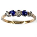 An 18ct gold diamond and sapphire five stone ring, the central diamond measuring 0.07ct, size L/M,
