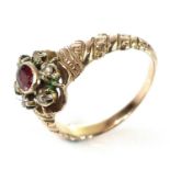 A Victorian gold, diamond and ruby set cluster ring, the milgrain set oval ruby measuring 0.08ct,