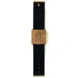 An Yves Saint Laurent gilt metal bracelet compact.