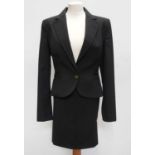 A Roberto Cavalli Just Cavalli black mixed fabric skirt suit, size 46.