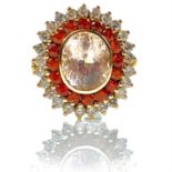 An attractive contemporary 18ct gold morganite, orange sapphire and diamond cluster dress ring,