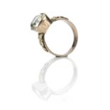 A Victorian gold Chrysberyl set ring, the cushion cut stone in a collet setting measuring 5.2ct