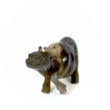 A Chinese agate model of a buffalo, 18th/19th century, height 5cm, length 9.3cm.one rear leg
